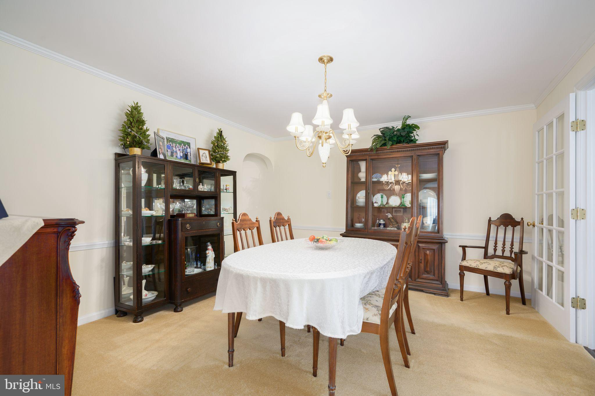 624 Warwick Road Haddonfield, NJ 08033 - Photo 15 of 43 a view of a dining room with furniture and chandelier