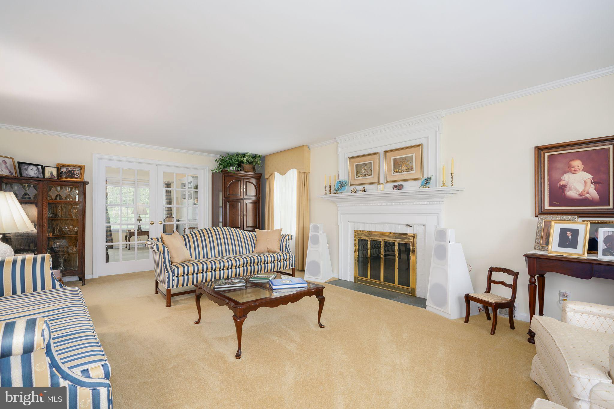 624 Warwick Road Haddonfield, NJ 08033 - Photo 16 of 43 a living room with furniture and a fireplace
