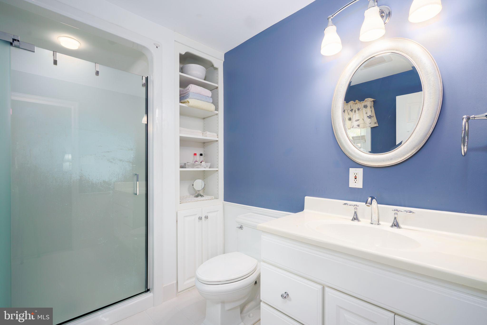 624 Warwick Road Haddonfield, NJ 08033 - Photo 22 of 43 a bathroom with a toilet a sink and a mirror