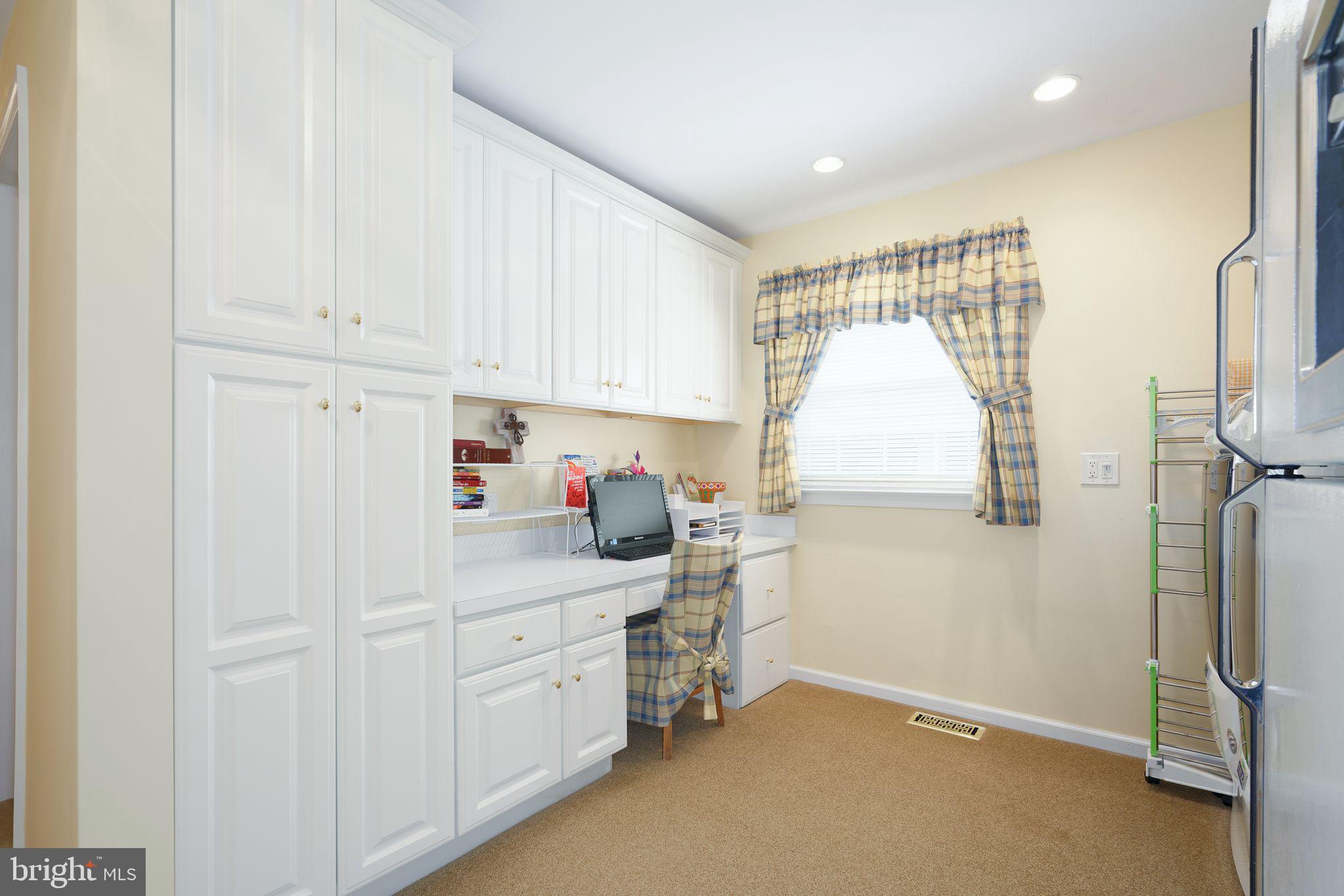 624 Warwick Road Haddonfield, NJ 08033 - Photo 24 of 43 a kitchen with white cabinets and white appliances