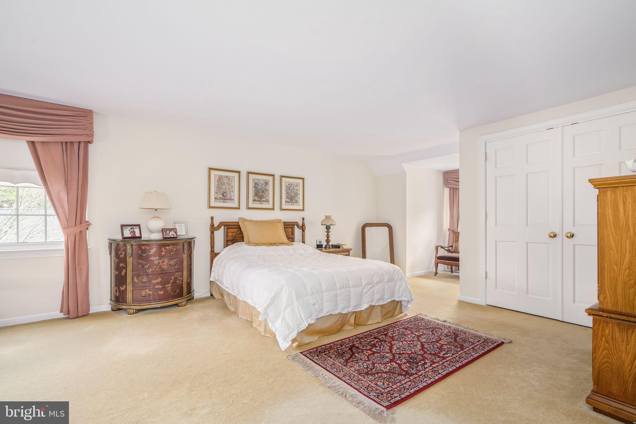 624 Warwick Road Haddonfield, NJ 08033 - Photo 28 of 43 a bedroom with a large bed a rug and dresser