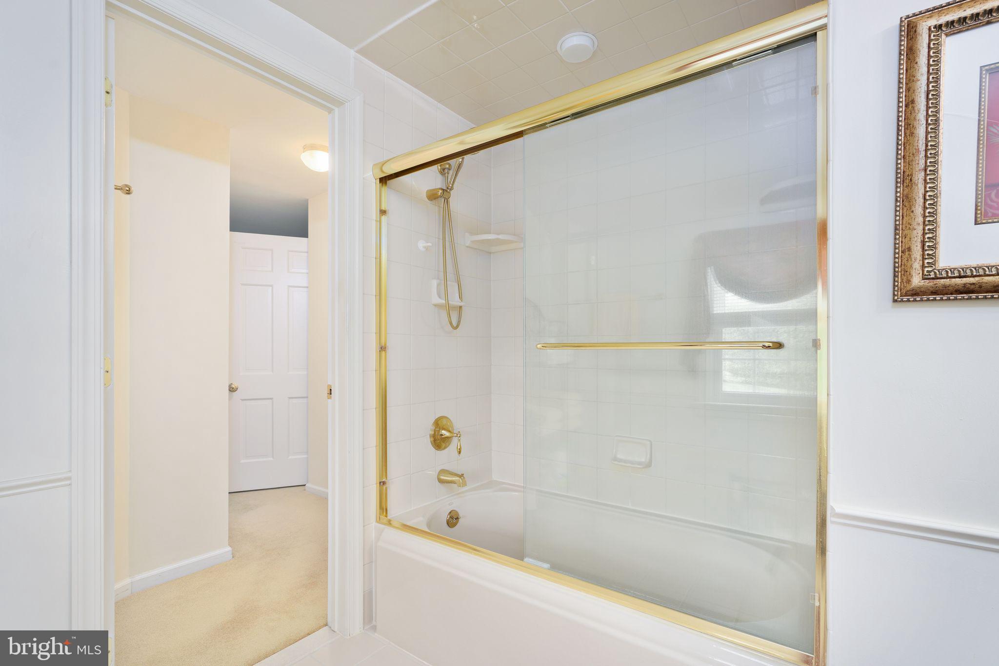 624 Warwick Road Haddonfield, NJ 08033 - Photo 32 of 43 a bathroom with a bathtub and a shower