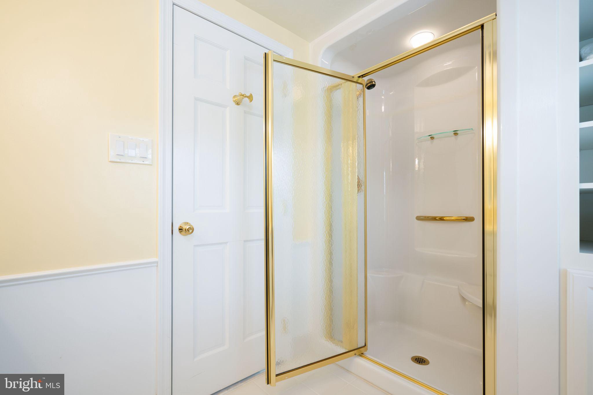 624 Warwick Road Haddonfield, NJ 08033 - Photo 35 of 43 a bathroom with a glass shower door