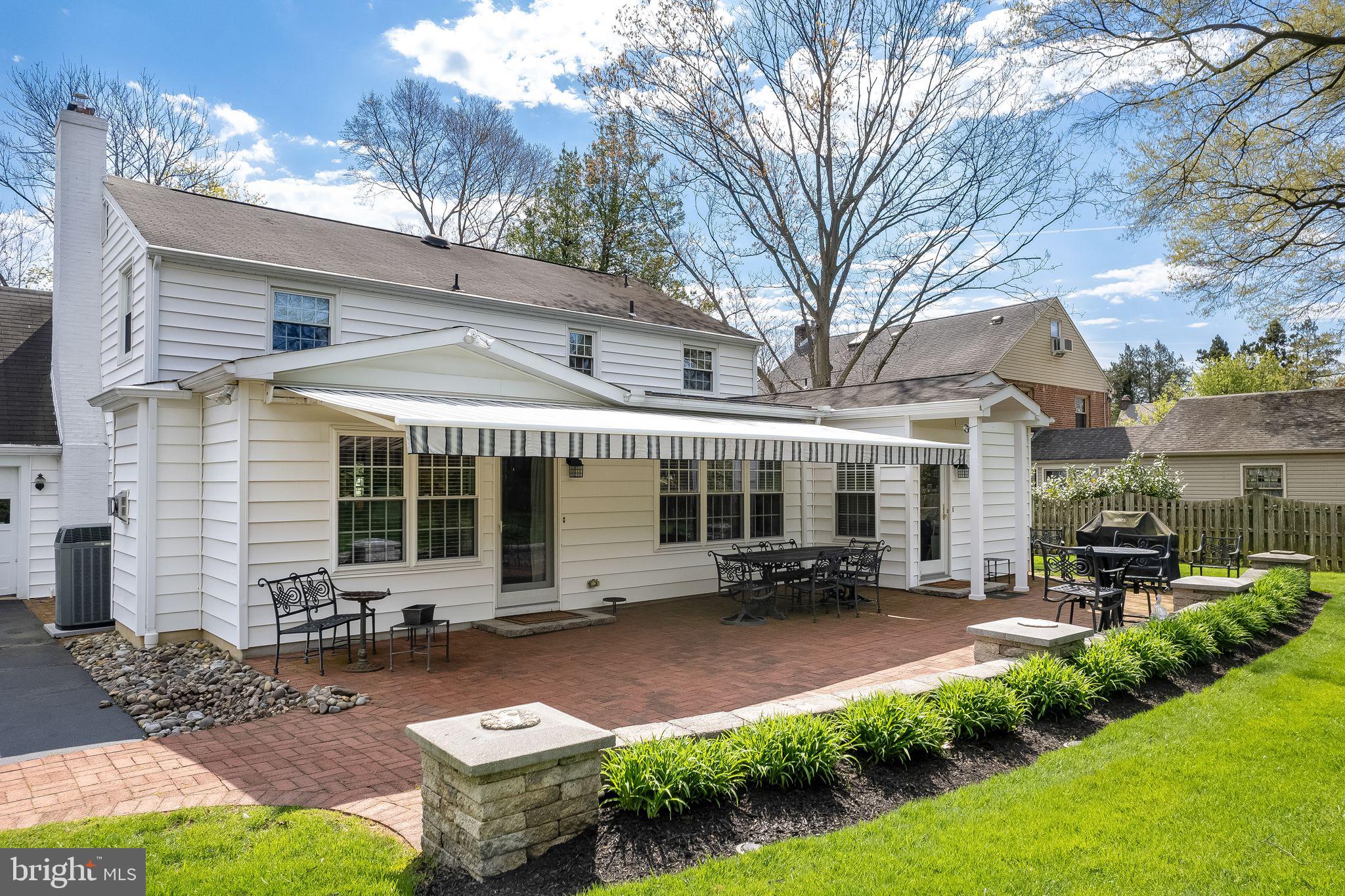 624 Warwick Road Haddonfield, NJ 08033 - Photo 37 of 43 a view of a patio with table and chairs under an umbrella
