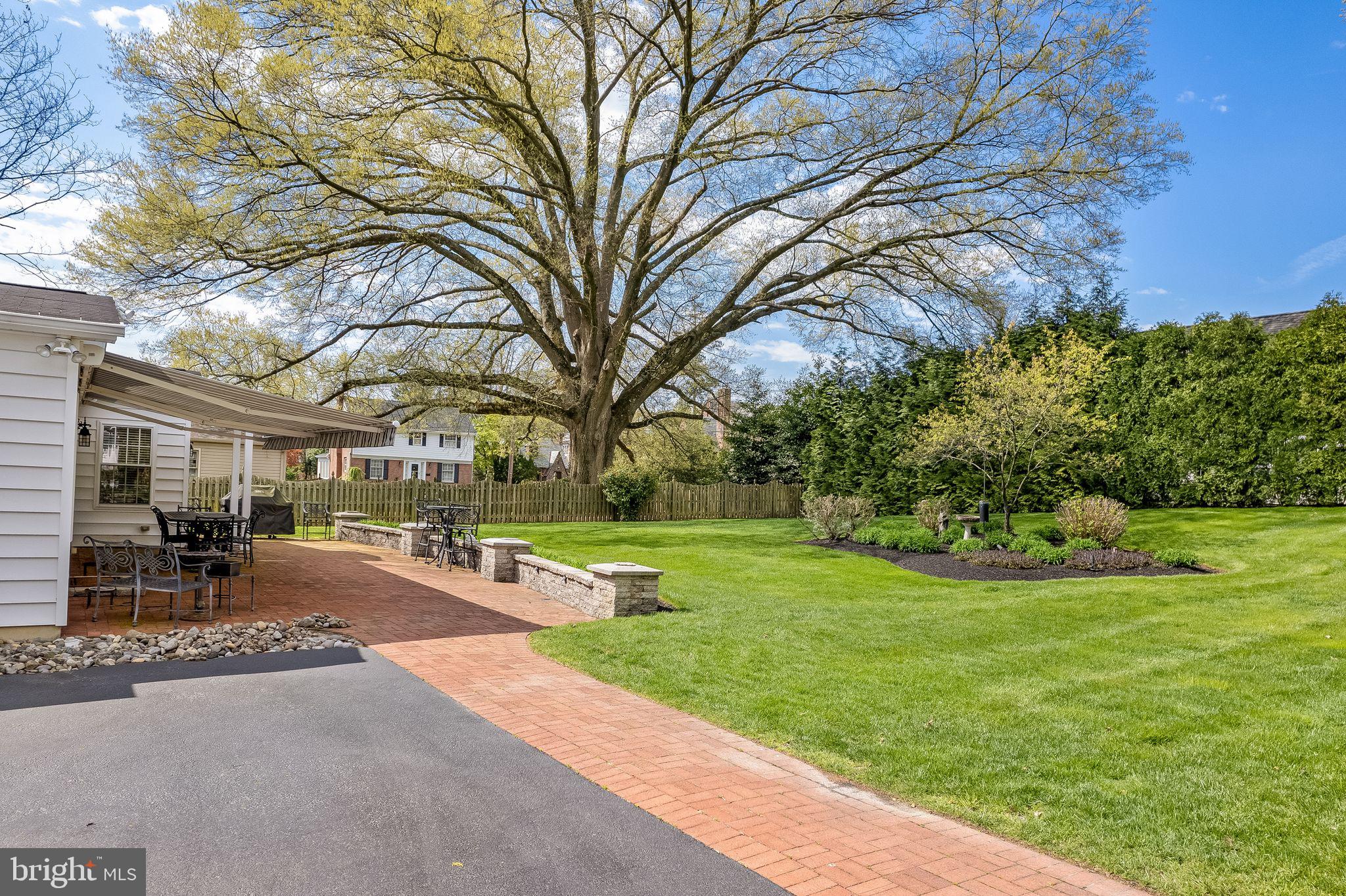 624 Warwick Road Haddonfield, NJ 08033 - Photo 38 of 43 a garden with trees in front of it