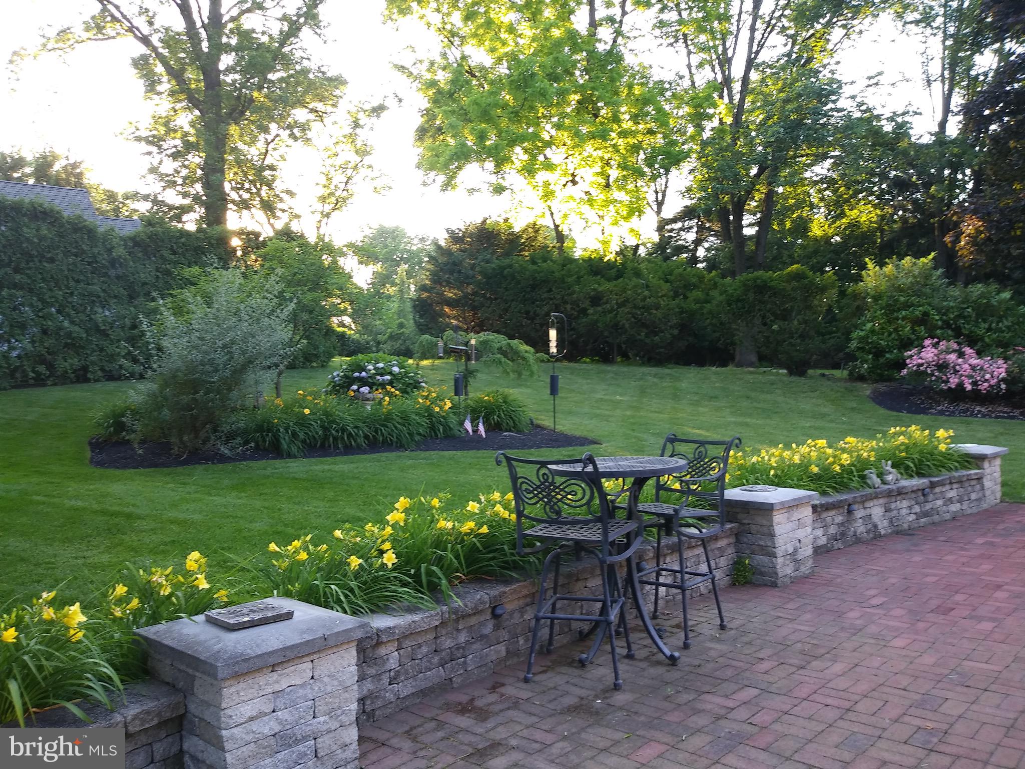 624 Warwick Road Haddonfield, NJ 08033 - Photo 4 of 43 a view of a table and chairs in patio with a yard