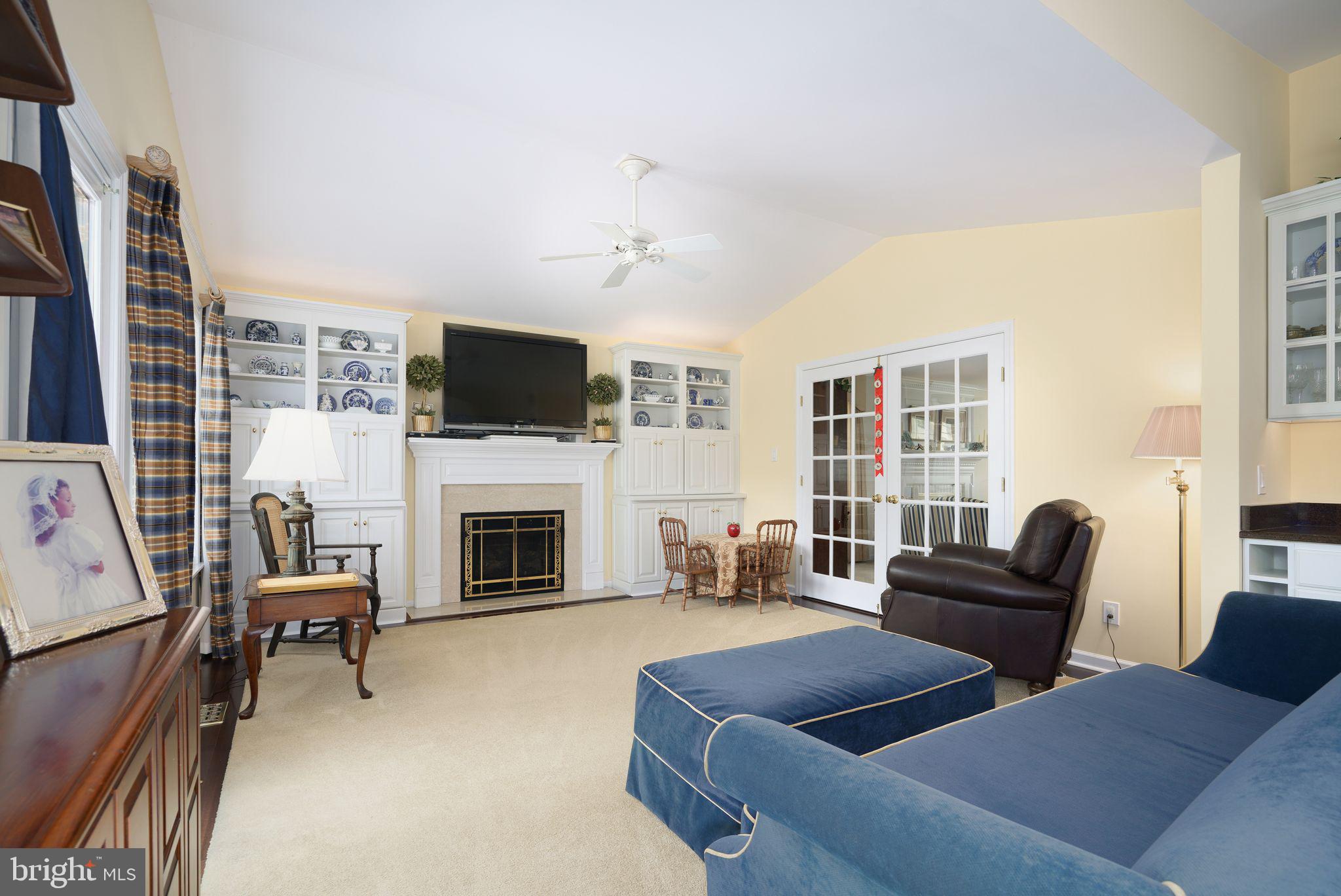 624 Warwick Road Haddonfield, NJ 08033 - Photo 5 of 43 a living room with furniture a fireplace and a flat screen tv
