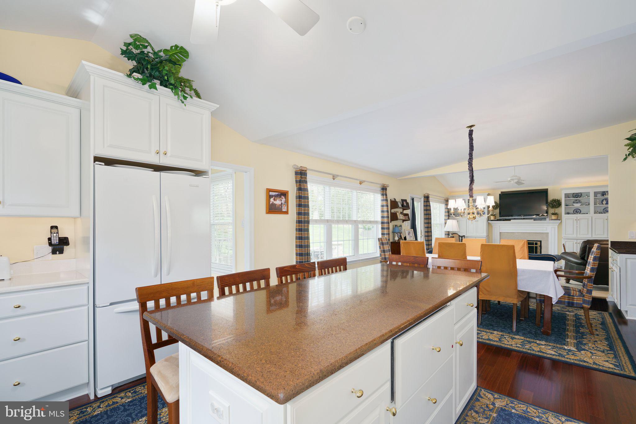 624 Warwick Road Haddonfield, NJ 08033 - Photo 9 of 43 a room with stainless steel appliances kitchen island granite countertop a table chairs in it and white cabinets