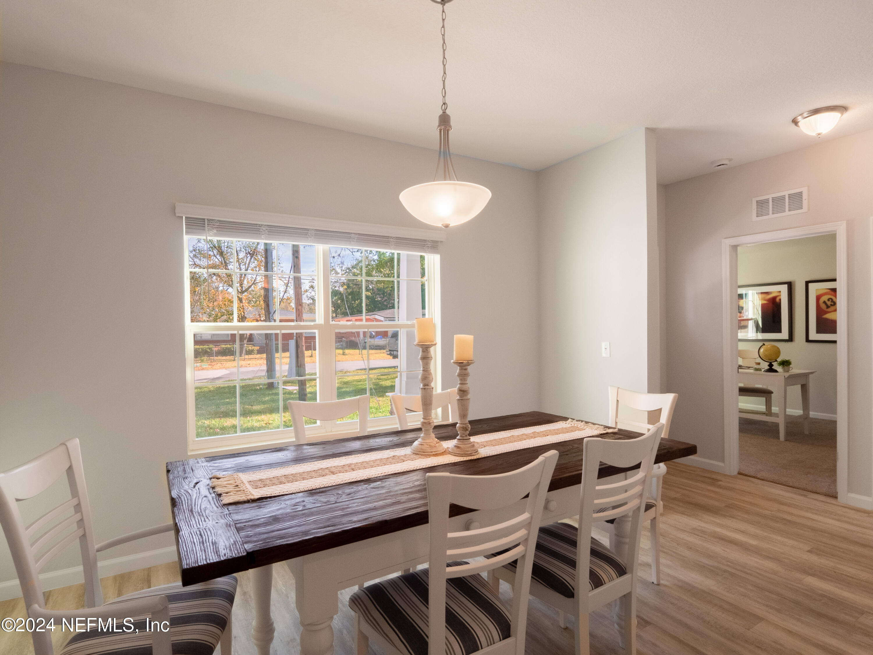 4011 Spring Glen Road Jacksonville, FL 32207 - Photo 11 of 38 a kitchen with a table and chairs in it