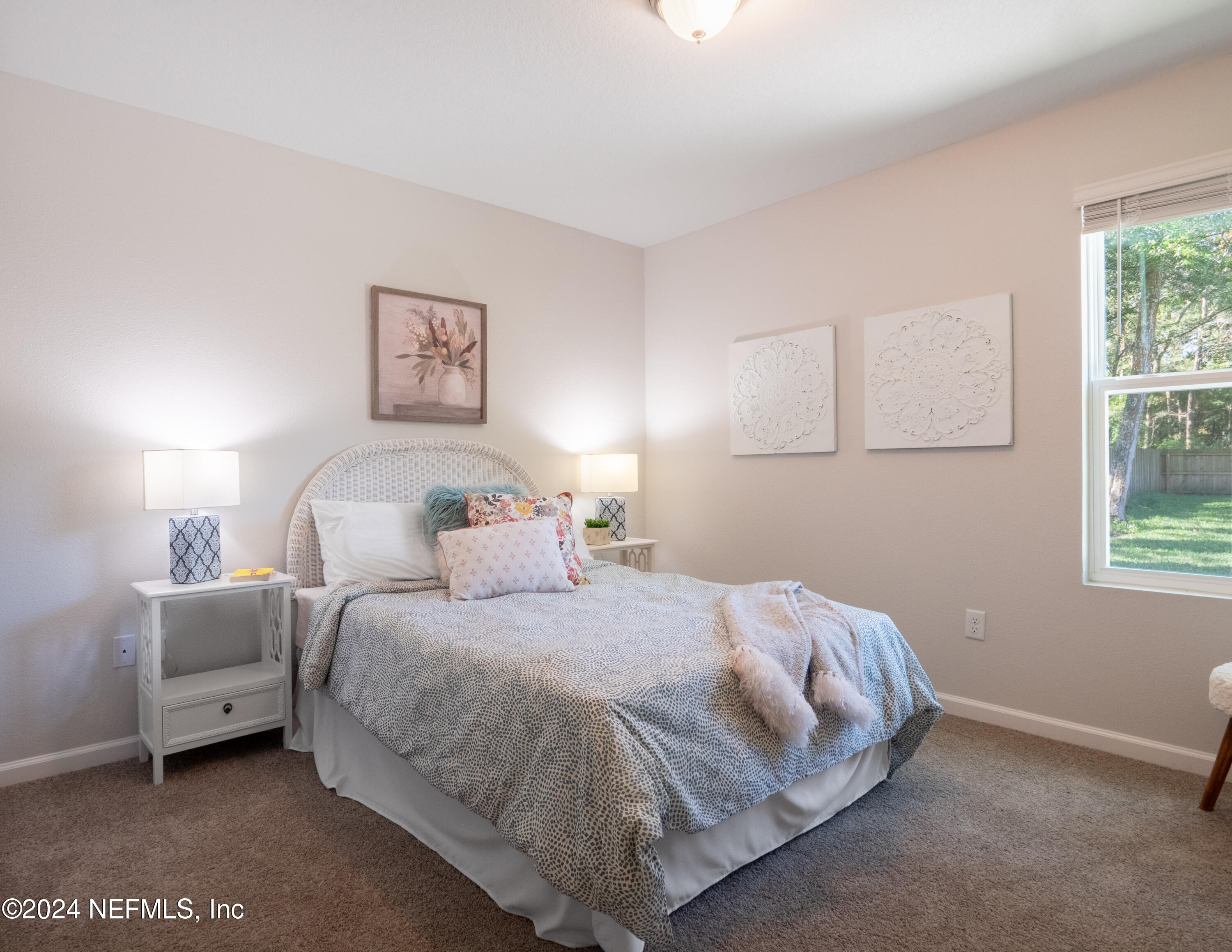 4011 Spring Glen Road Jacksonville, FL 32207 - Photo 35 of 38 a bedroom with a bed and a night stand