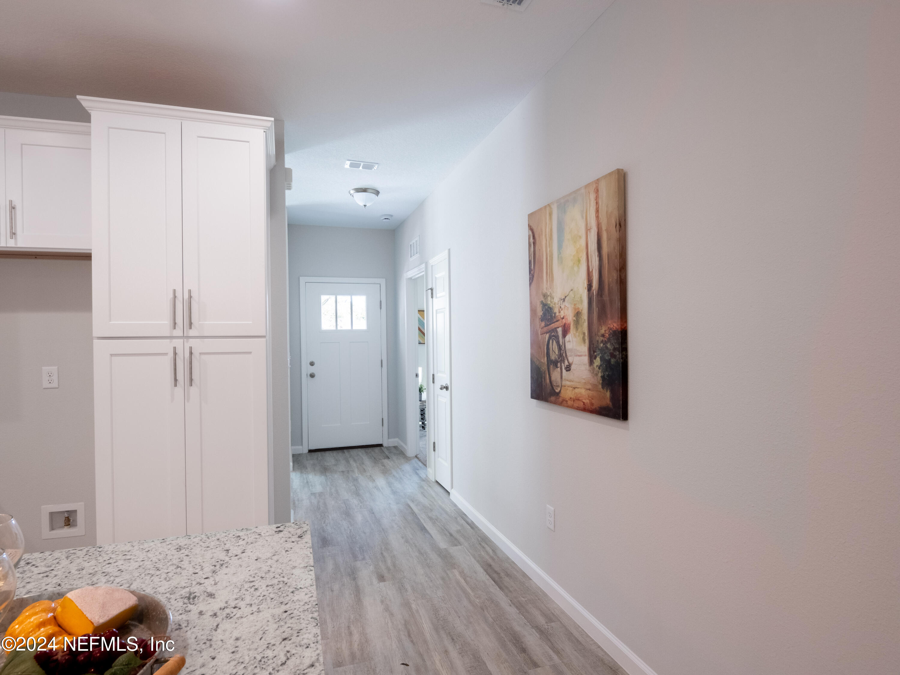 4011 Spring Glen Road Jacksonville, FL 32207 - Photo 7 of 38 a view of a hallway with wooden floor and closet