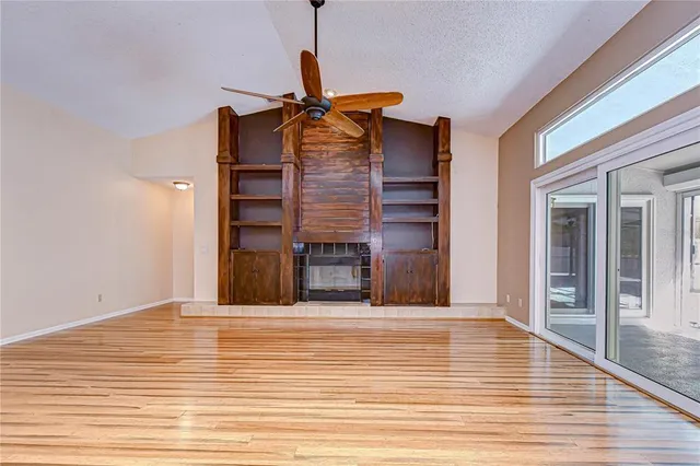 a view of a kitchen with a sink and a large window