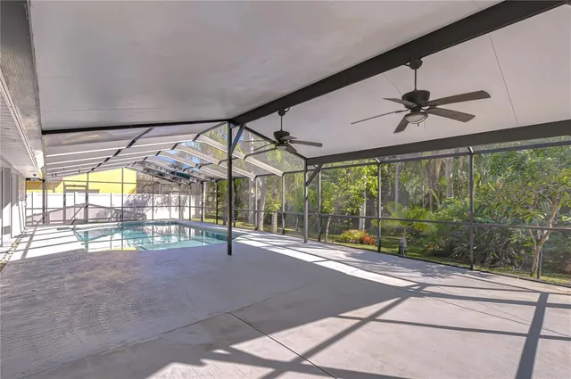 a view of swimming pool with a lounge chairs