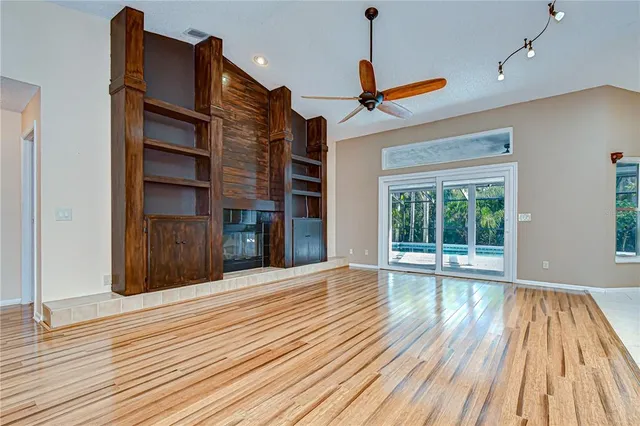 a view of a room with wooden floor and closet