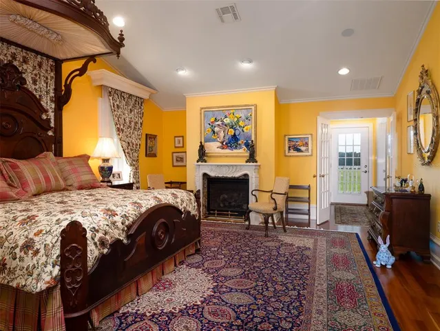 a bed room with a bed and a fireplace