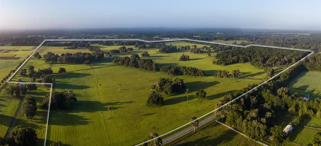 a view of a swimming pool with seating area