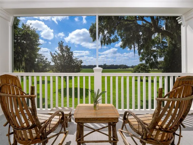 a view of a chairs and table in patio
