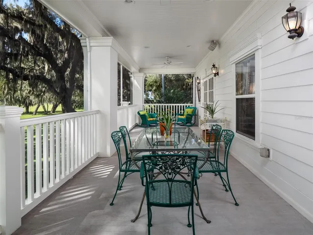 a view of a deck with furniture and window
