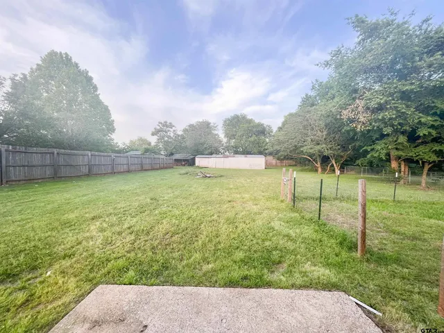 a view of a garden with a lake