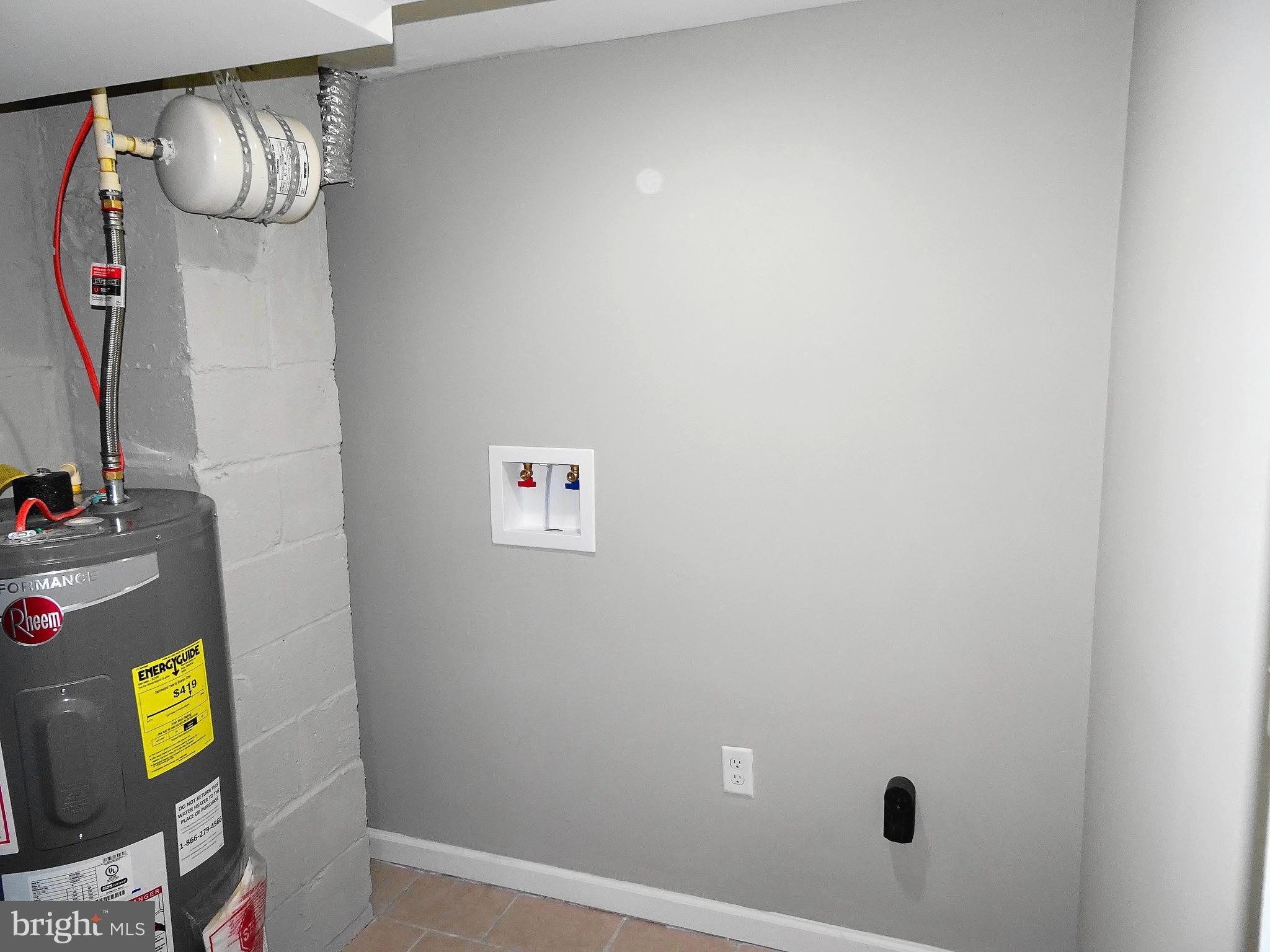1732 Hartsdale Road Baltimore, MD 21239 - Photo 28 of 30 laundry & storage room - new hot water heater
