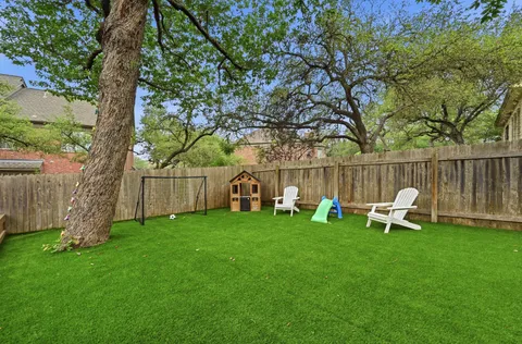 a view of a bench in a backyard
