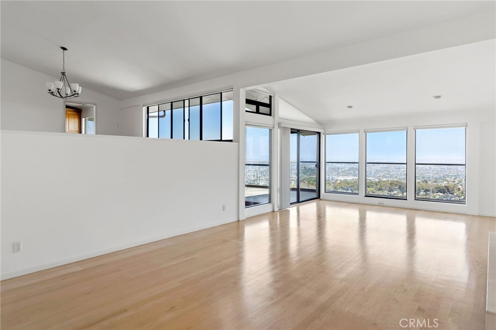 972 Via Rincon Palos Verdes Estates, CA 90274 - Photo 14 of 37 a view of an empty room with wooden floor and a window