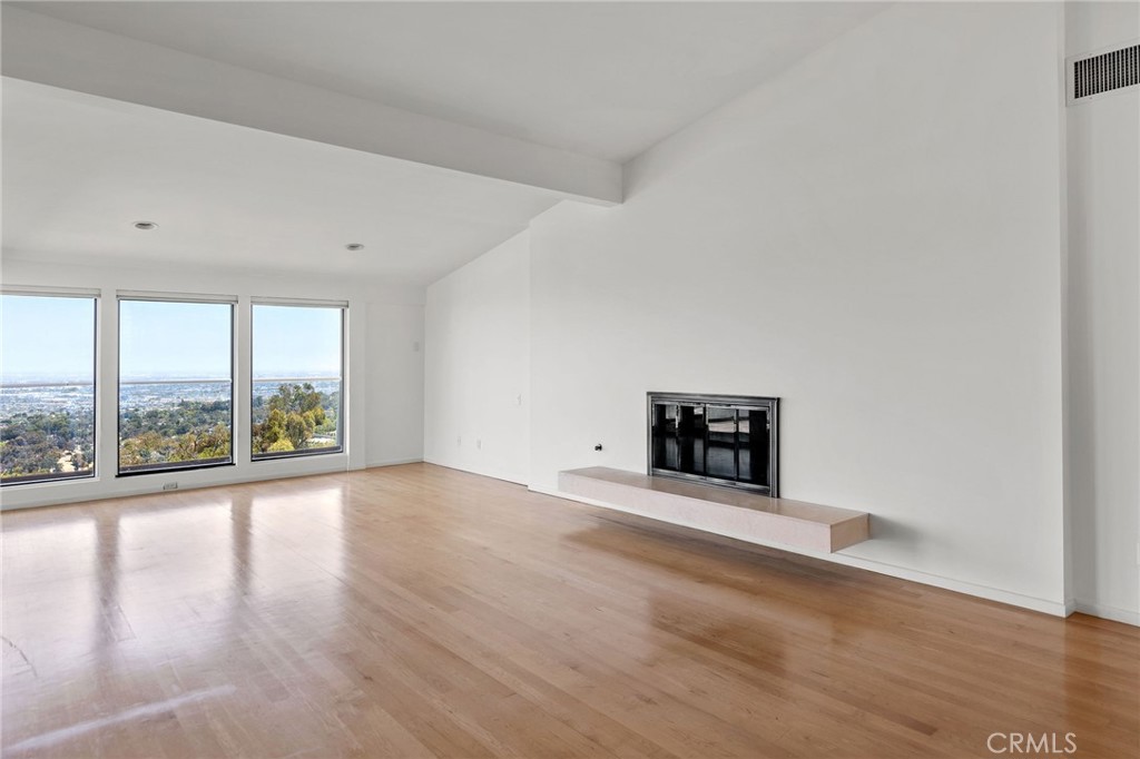 972 Via Rincon Palos Verdes Estates, CA 90274 - Photo 15 of 37 an empty room with wooden floor and a large window