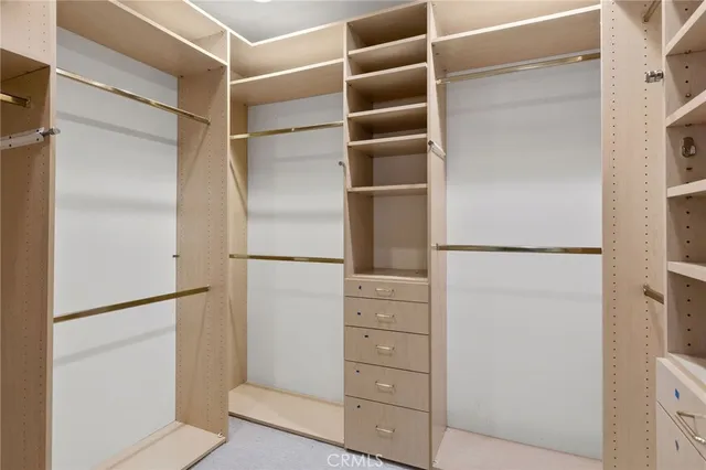 a view of an empty room and a fireplace