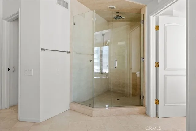 an empty room with furniture and a fireplace