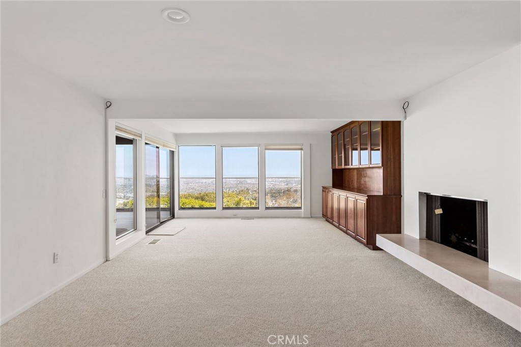972 Via Rincon Palos Verdes Estates, CA 90274 - Photo 28 of 37 a view of an empty room and a fireplace