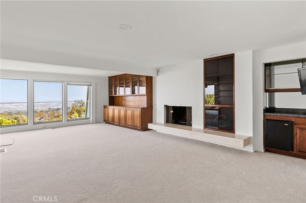 972 Via Rincon Palos Verdes Estates, CA 90274 - Photo 29 of 37 an empty room with furniture and a fireplace