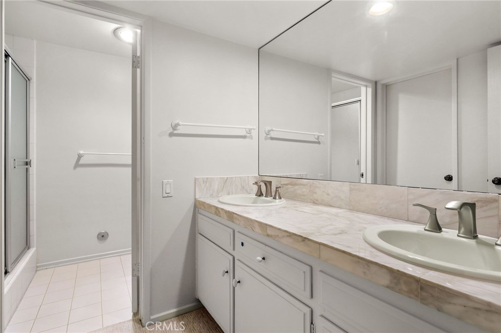 972 Via Rincon Palos Verdes Estates, CA 90274 - Photo 37 of 37 a bathroom with a granite countertop sink and a mirror