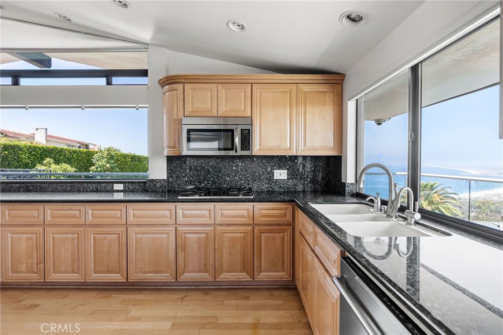 972 Via Rincon Palos Verdes Estates, CA 90274 - Photo 6 of 37 a kitchen with stainless steel appliances granite countertop a sink and a stove
