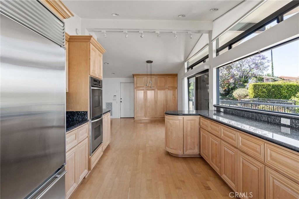 972 Via Rincon Palos Verdes Estates, CA 90274 - Photo 8 of 37 a large white kitchen with a large window