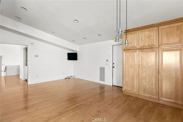 a view of an entryway with wooden floor