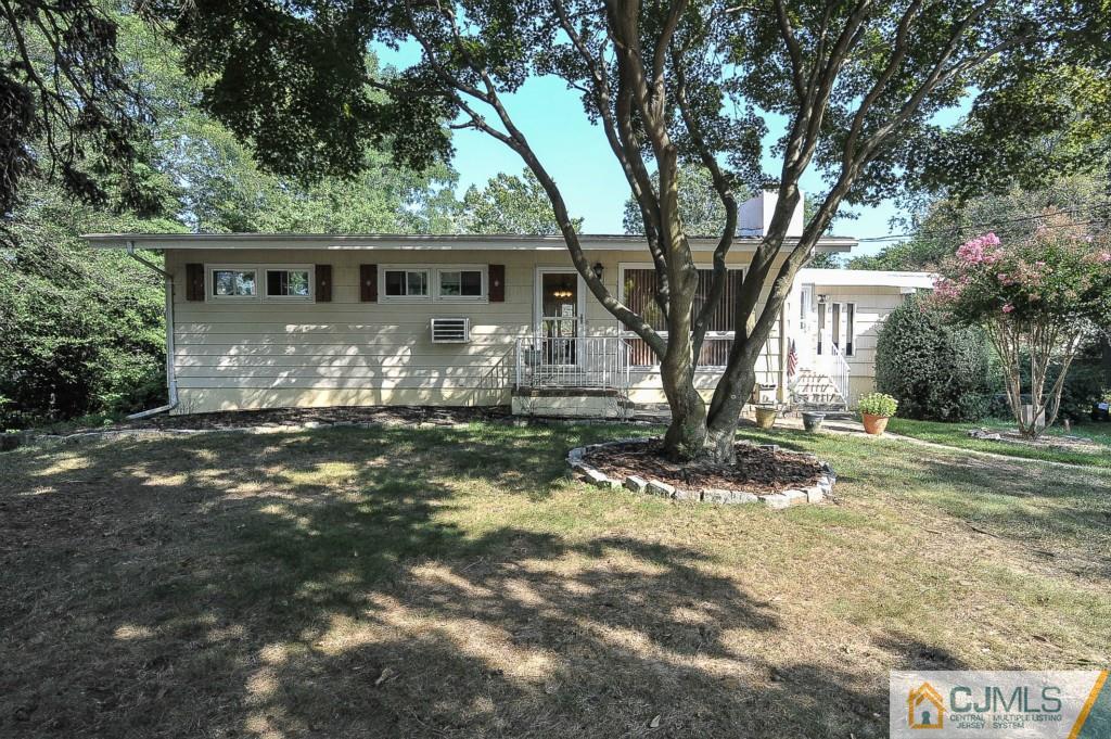 36 Middlesex Road Matawan, NJ 07747 - Photo 14 of 14 a view of a house with yard next to a large tree