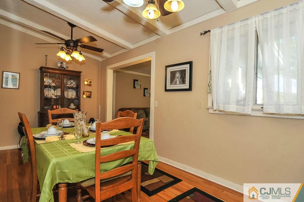36 Middlesex Road Matawan, NJ 07747 - Photo 3 of 14 a view of a dining room with furniture and a chandelier