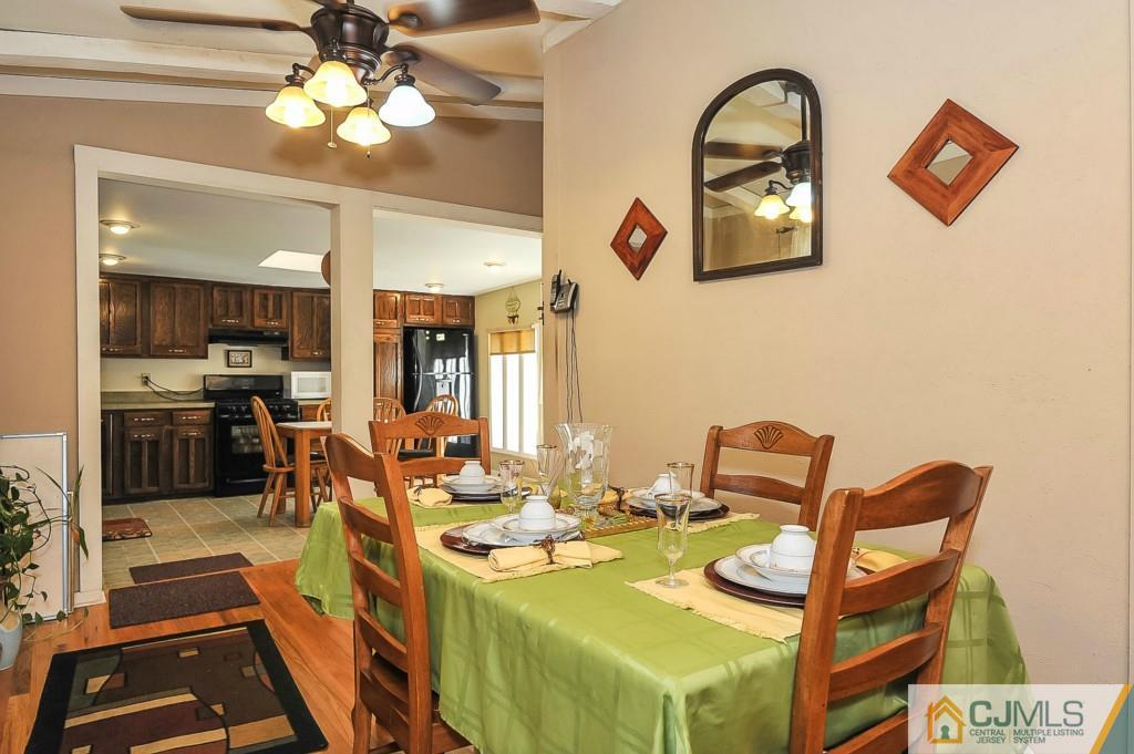 36 Middlesex Road Matawan, NJ 07747 - Photo 4 of 14 a view of a dining room with furniture and a chandelier