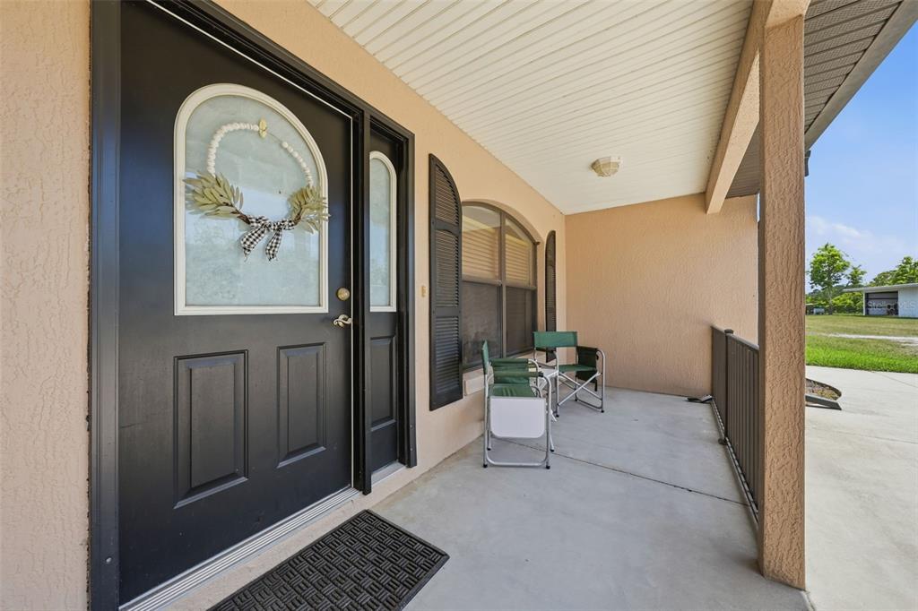 14433 Lake Yale Road Umatilla, FL 32784 - Photo 7 of 38 a view of a door and chair the front door