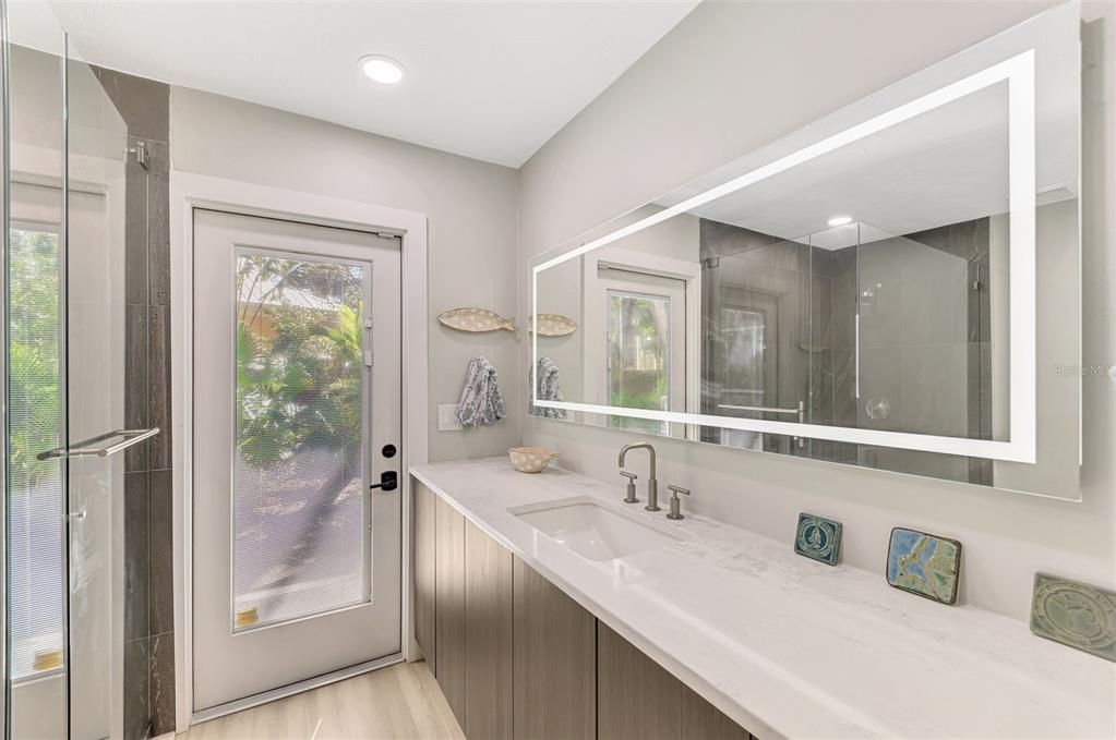 5303 Hidden Harbor Road Sarasota, FL 34242 - Photo 31 of 72 a bathroom with a sink and a mirror