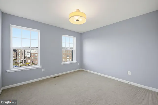 an empty room with windows and window