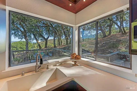 a bathroom with a sink and a large window