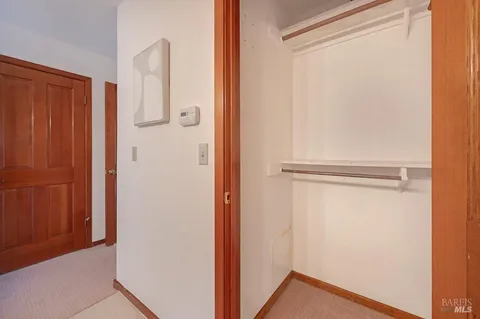 a view of a small space with wooden floor