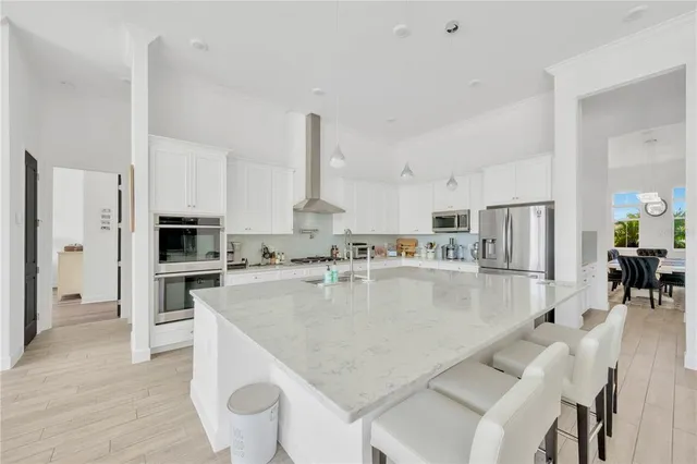 a bedroom with furniture and a large window