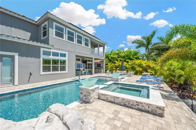 a house view with a sitting space and garden