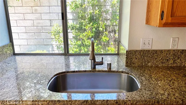 a bathroom with a sink and a window
