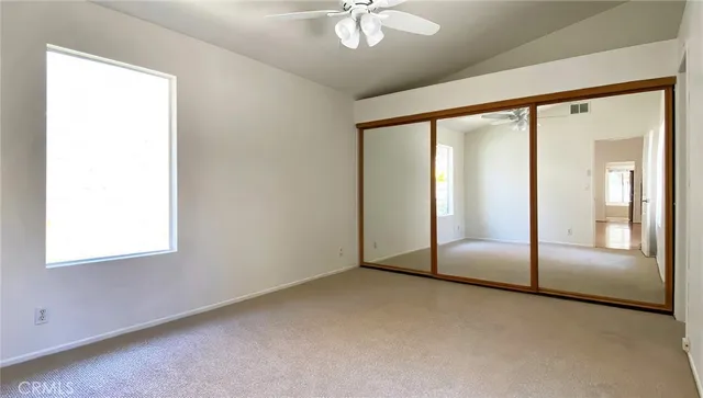 an empty room with fan