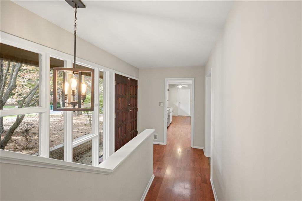 705 Edgewater Trail Sandy Springs, GA 30328 - Photo 12 of 36 a view of a living room with a large window