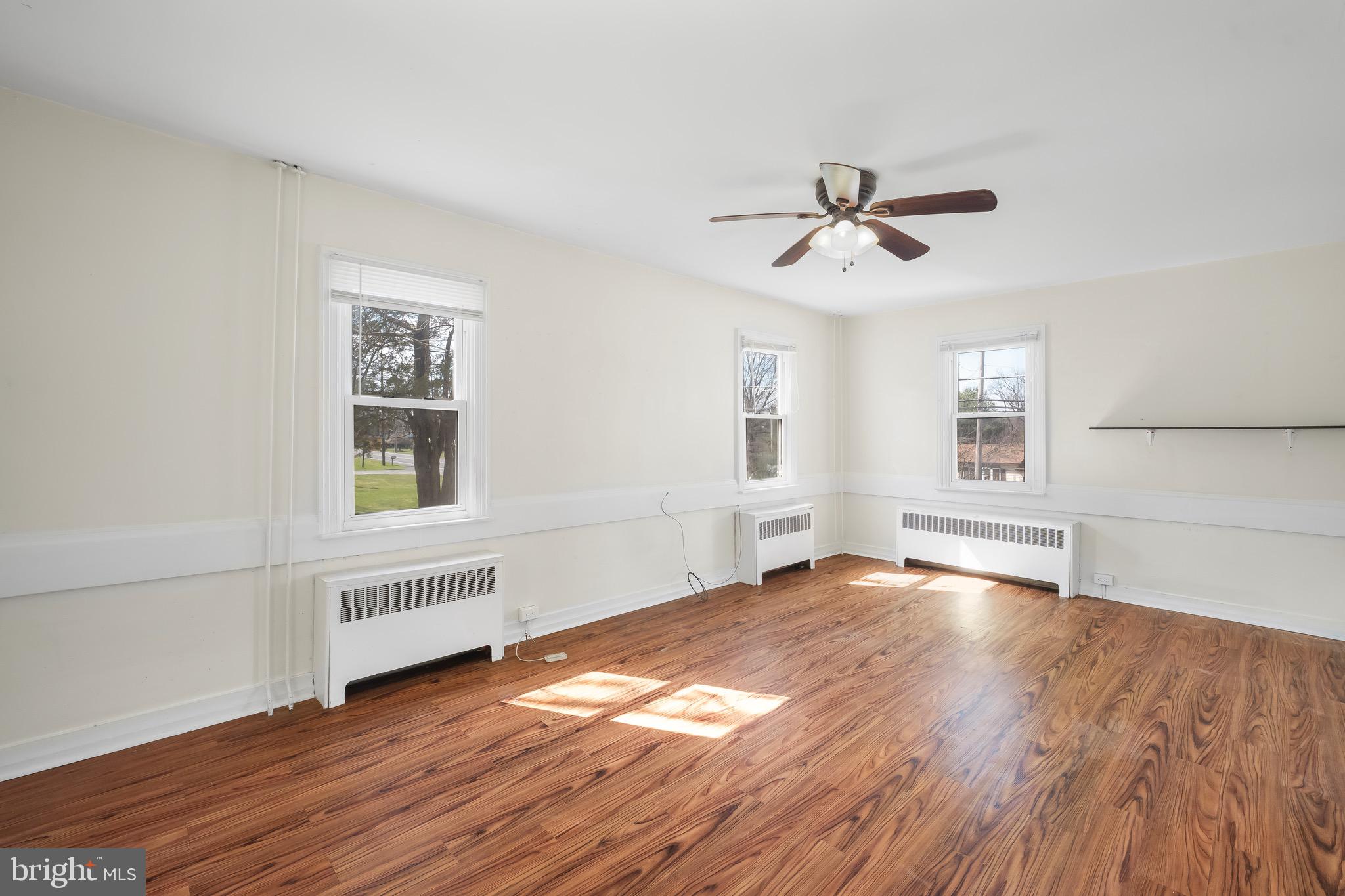 638 State Street Mertztown, PA 19539 - Photo 14 of 25 a view of empty room with wooden floor and fan