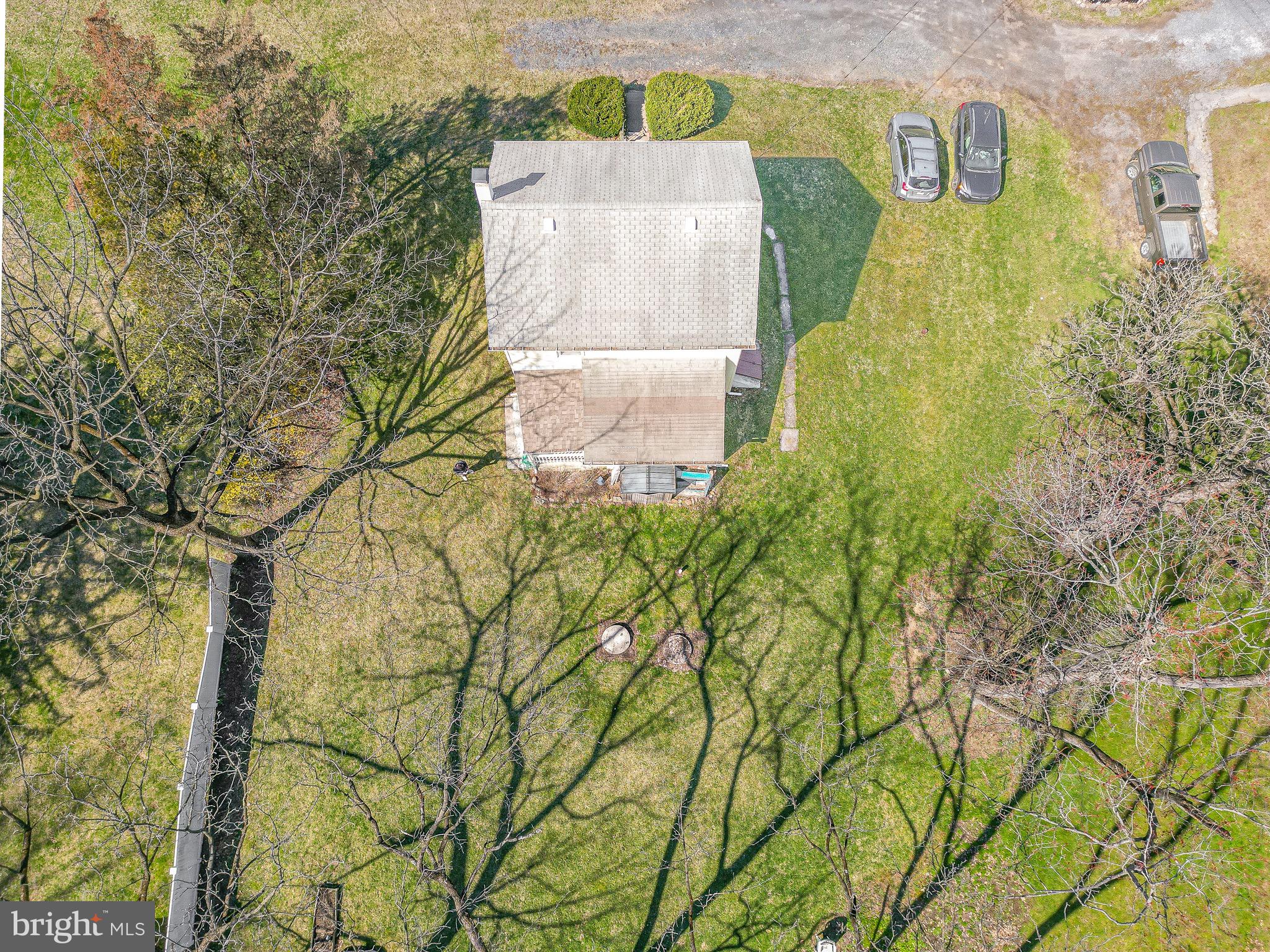 638 State Street Mertztown, PA 19539 - Photo 4 of 25 an aerial view of a house with a yard and signage